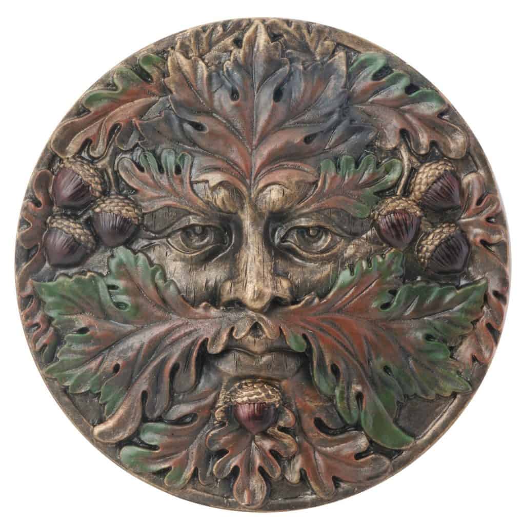 A Green Man face plaque