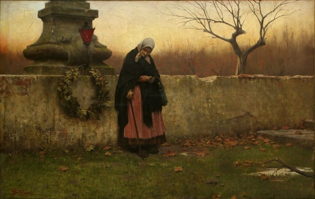 Painting of an elderly woman in a headscarf, dark shawl and red striped skirt, leaning on a walking stick beside a cemetery wall hung with a wreath, with a red lantern on a stone monument, fallen autumn leaves and a bare tree