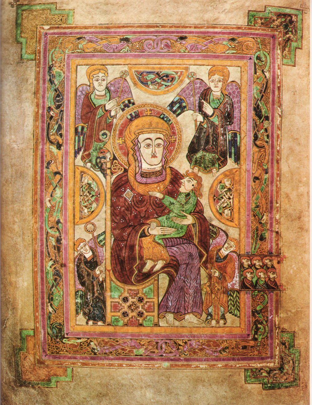 Book of Kells page showing Mary enthroned with the infant Jesus on her knee, with four angels around them, inside a decorated frame