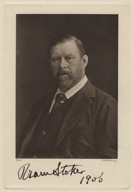 Sepia portrait of Bram Stoker in 1906, a heavy-set bearded man in a dark suit and tie, with his signature and the date written below