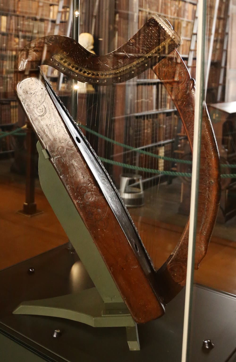 The Trinity College harp, the so-called Brian Boru harp: a carved dark-wood medieval Irish harp with brass strings in a glass case in Trinity College Dublin's Long Room