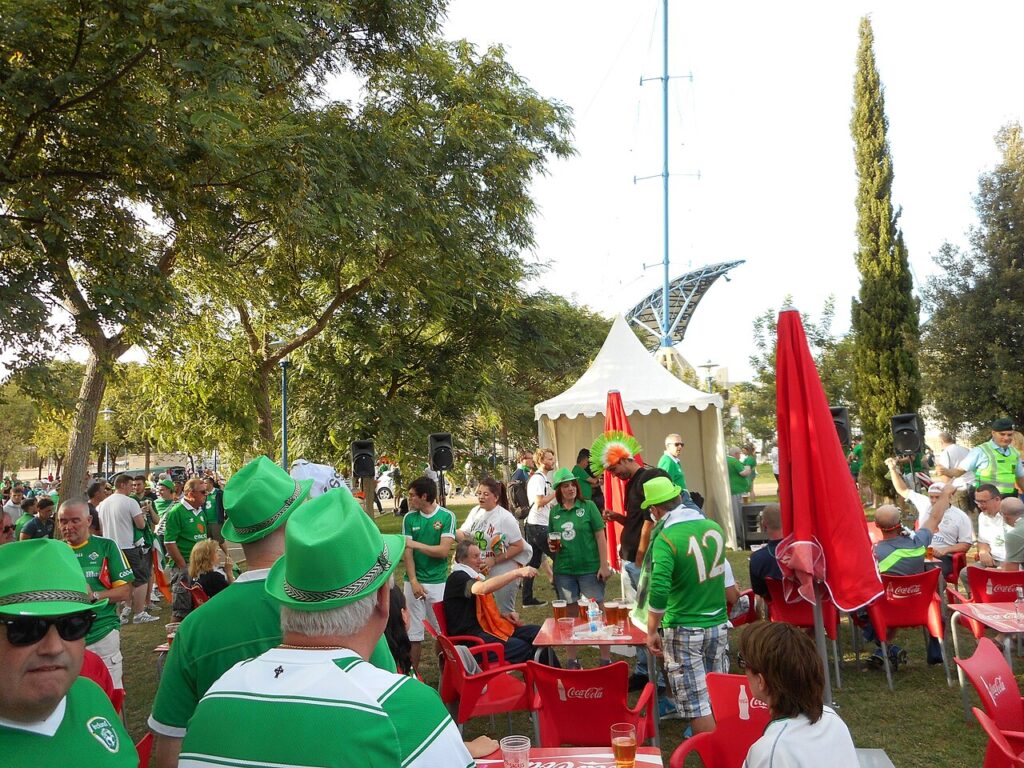 Republic of Ireland football fans in green at a fan zone