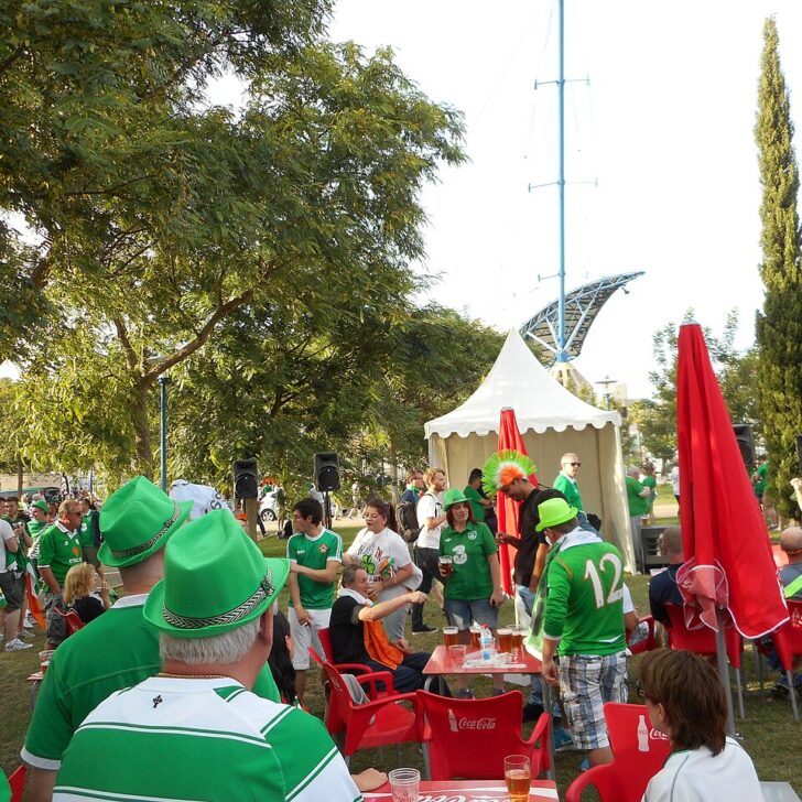 Republic of Ireland football fans in green at a fan zone