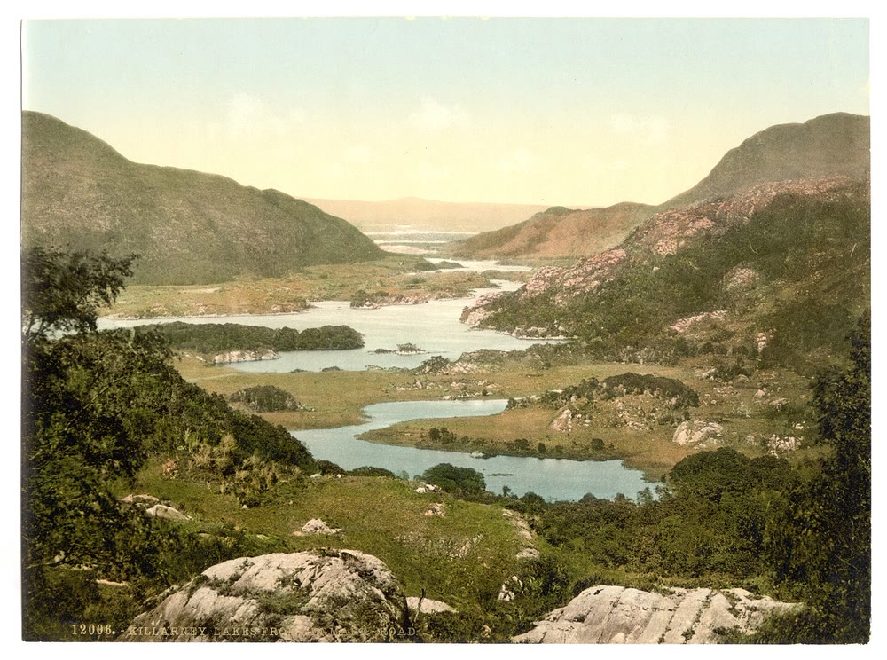Hand-coloured 1890s view of green hills and the lakes of Killarney seen from the Kenmare road, Co. Kerry