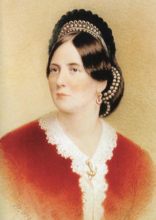 Watercolour portrait of Lady Jane Wilde in 1864, her dark hair dressed with a pearl diadem, with a white lace collar and a red shawl